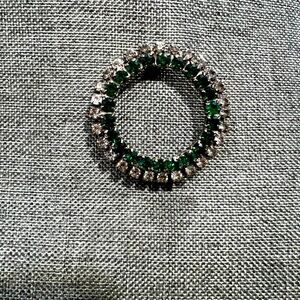 Costume jewelry Pendant Emerald Green Center And Diamonds on the Outer Ring.